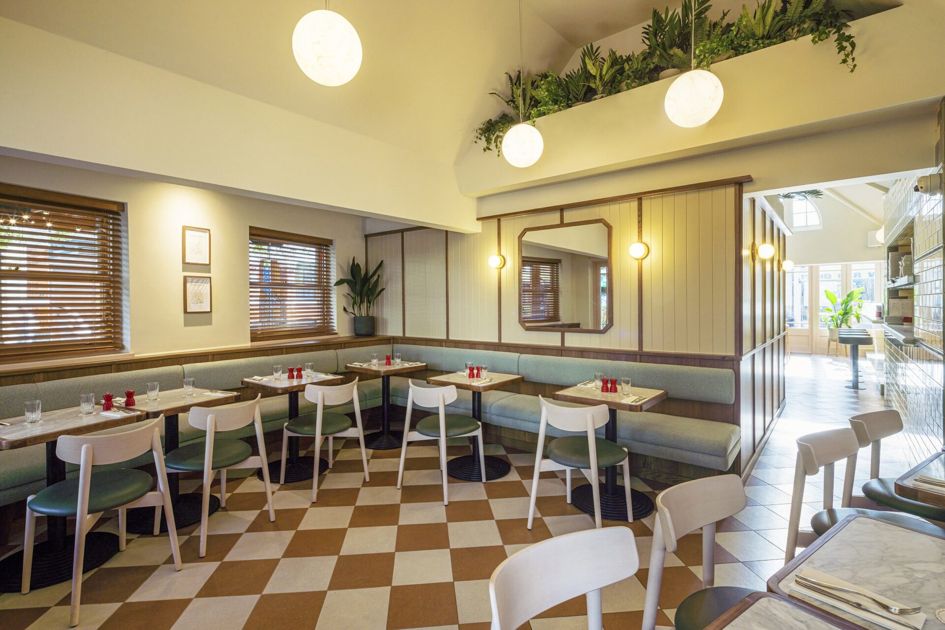 Audrey's Cafe & Bar Borough modern and retro restaurant designed by 3Stories Interior Design and branding creative agency London, featuring checkered floor, cosy and unpretencious interior