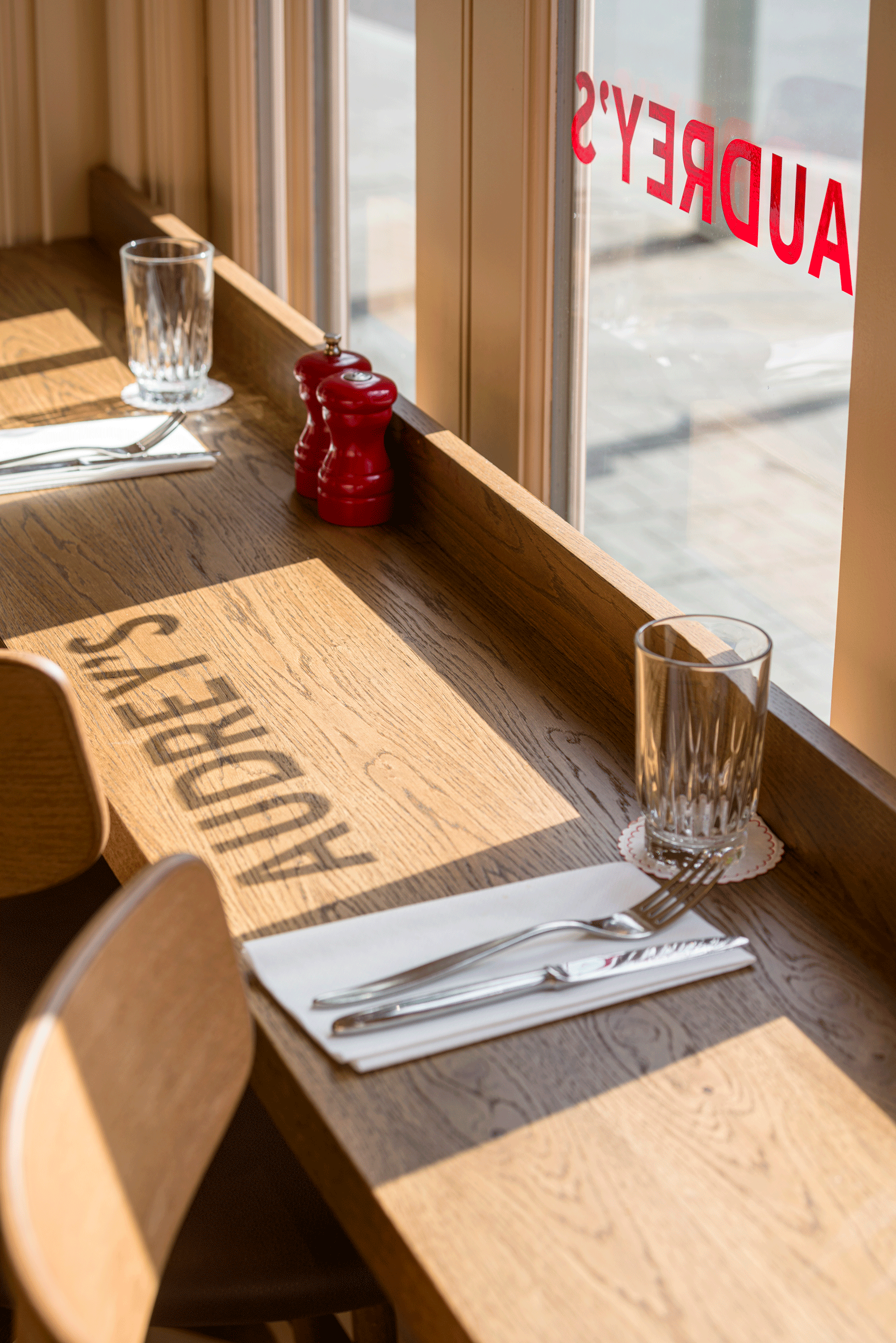 wooden table top Audrey's Cafe & Bar Borough modern and retro restaurant designed by 3Stories Interior Design and branding creative agency London, cosy and unpretencious interior