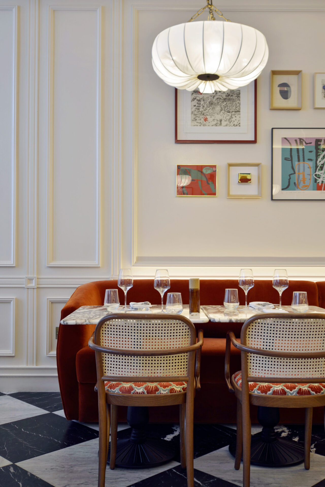Elengant interior Banquette seating and paintings at Le Petit BeefBar Restaurant Edinburgh inside Hotel Intercontinental the George